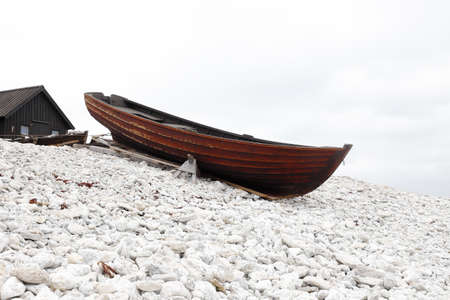 Old wooden open small fishing boat at the Helgumannen fishing station in Swedish province of Gotland.の写真素材
