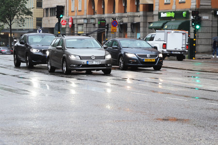 Stockholm, Sweden - August 16, 2021:Traffik in downtown Stockholm on the Sveavagen street during a rainy day.のeditorial素材