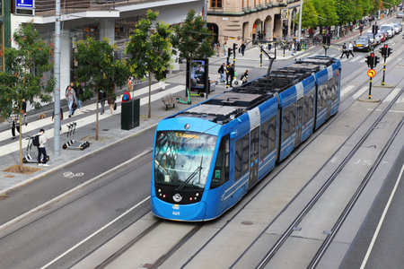 Stockholm, Sweden - September 2, 2021: High angle view of an artiiculated tram class A35 in service on line 7 at Hamngatan street.のeditorial素材