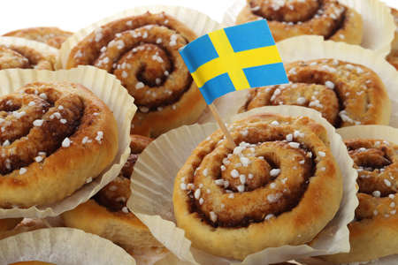 Traditional cinnamon rolls decorated with a Swedish flag.の写真素材