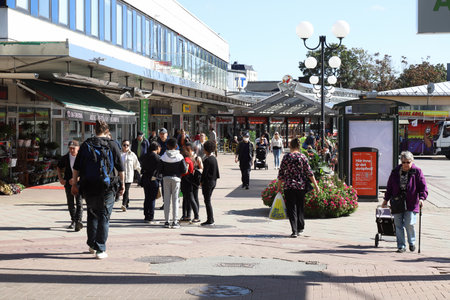 Stockholm, Sweden - August 31, 2021: People at the suburban Hogdalen centre at the metro station.のeditorial素材