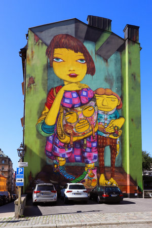 Stockholm, Sweden - August 30, 2021:Graffiti artwork on the wall at Fiskargatan 8, Stockholm, created in 2017 by Os Gemeos, consisting of the twin brothers OtÃ¡vio and Gustavo Pandolfo (b. 1974).のeditorial素材
