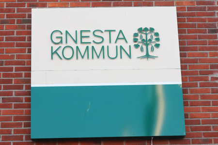Gnesta, Sweden - February 26, 2022: Close-up view of the Gnesta municipality sign attachhed to the town hall.のeditorial素材