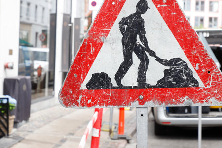 Roadwork sign in a city street.