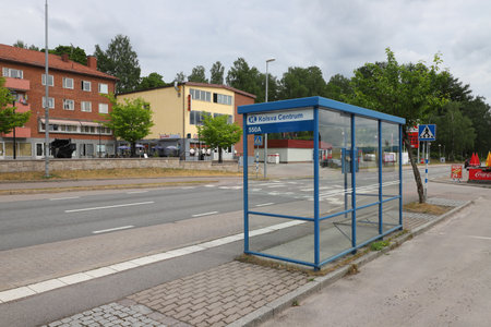 Kolsva, Sweden - June 19, 2023: View of the Kolsva town center with the bus stop shelter in the foreground.のeditorial素材