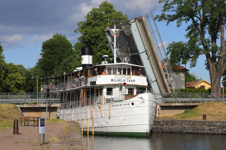 Motala, Sweden - June 27, 2023: The passenger ship Wilhelm Tham constructed 1912 exits the Gota canal into lake Vattern in Motala.のeditorial素材