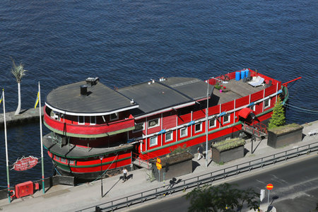 Stockholm, Sweden - July 24, 2023: High angle view of the Red Boat hotel located at the Soder Malarstrand street near the Old Town.のeditorial素材