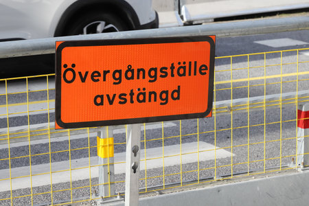 Sign in the Swedish langugae informs that the crosswalk is closed.の写真素材
