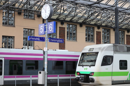 Helsinki, Finland - September 5, 2023: Bilingual Helsinki railroad station name sign at platform 5 and 6.のeditorial素材