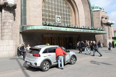 Helsinki, Finland - September 5, 2023: Taxi outside the main entrance to the Helsinki railroad station.のeditorial素材