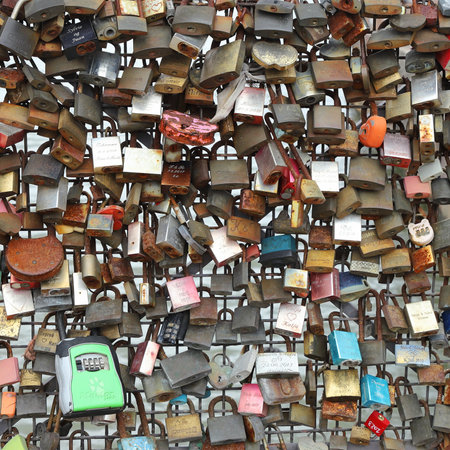Helsinki, Finland - September 5, 2023: Group of padlocks attached to the Rakkaudensilta bridge railing..のeditorial素材