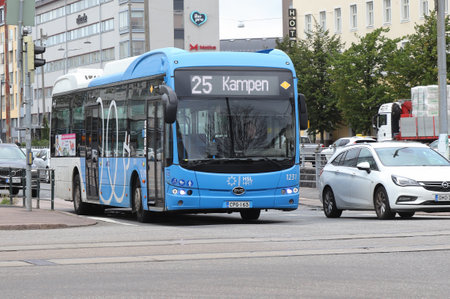 Helsinki, Finland - September 5, 2023: Blue electric powered bus on route 25 to Kamppi at the Pohjoinen Rautatiekatu street in service for the HSL.のeditorial素材