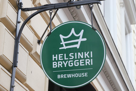 Helsinki, Finland - September 5, 2023: The Helsinki Bryggeri sign, a brewhouse and restaurant located at the Sofiankatu street.のeditorial素材