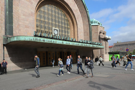 Helsinki, Finland - September 5, 2023: People outside the Helsinki Central railroad station building.のeditorial素材