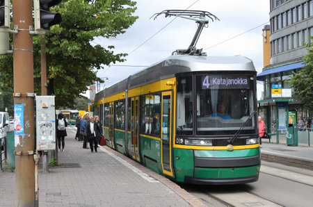 Helsinki, Finland - September 5, 2023: Articulated modern tram on route 4 toward Katajanokka in downtown Helsinki at the Lasipalatsi tram stop on the Mannerheim street.のeditorial素材