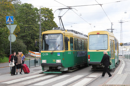 Helsinki, Finland - September 5, 2023: Two trams at the Olympia terminal stop.のeditorial素材