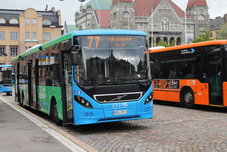Helsinki, Finland - September 5, 2023: Public transportation buses outside the Helsinki Central railroad station at the Rautatientori square.のeditorial素材