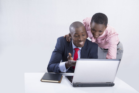 Business couple working on laptop の写真素材