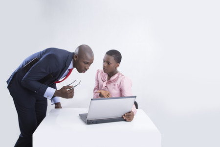 Business couple working on laptop の写真素材