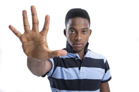 A young boy showing a stop sign on isolated background