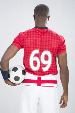 A rear view of a young footballerの写真素材