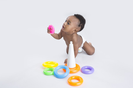 cute baby boy playing with toysの写真素材