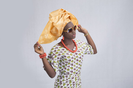 Young lady traditionally dressed with her hands up looking away