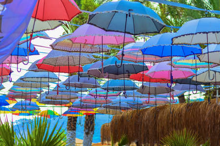 Multi-colored umbrellas are used on rest as a roof from the sunの写真素材