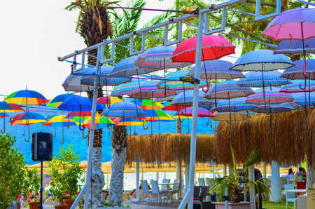 Multi-colored umbrellas are used on rest as a roof from the sunの写真素材