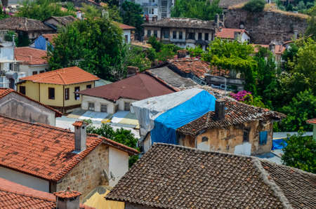 The roofs of the old houses of the city from the red tiles found in the tour of Antalyaの写真素材