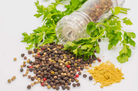 Fragrant black pepper on a white background, this is a common spice with useful properties