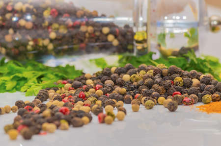 Fragrant black pepper on a white background, this is a common spice with useful properties