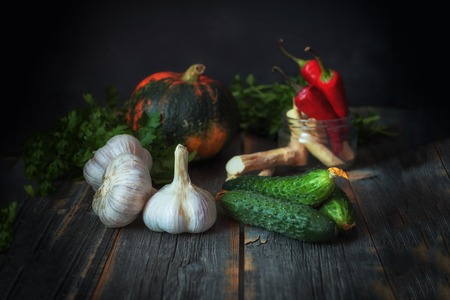 Different vegetables against a dark background in style a rusticの写真素材