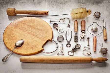 Old pieces of kitchen utensils on a table the top viewの写真素材