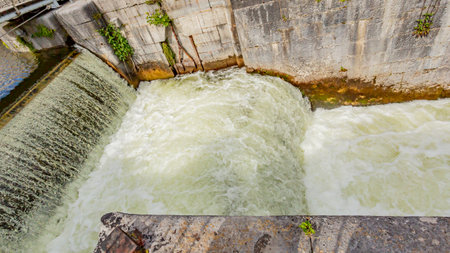 Closeup of Eglinton canal lock with flowing water forming small waterfalls, Waterways of Galway, hydroelectric engineering, Galway City, Connacht Province, Irelandの写真素材