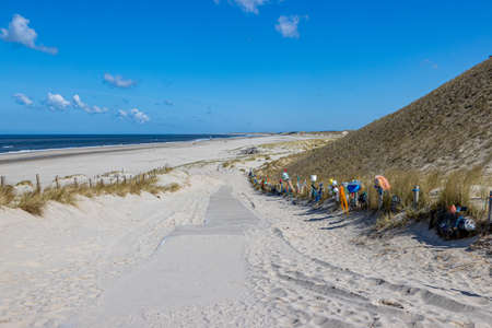 Petten aan Zee, North Holland, Netherlands. April 17, 2021. Open-air gallery next to the path to the beach conceived by Arnold Gronert, the Wall of Shame, art made with garbage collected on the beachのeditorial素材