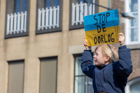 Roermond, Limburg, Netherlands. March 6, 2022. Protest against Russian armed invasion of Ukraine. Group of people peacefully demonstrating. Concept of pacifism and prayer for peace in the worldのeditorial素材