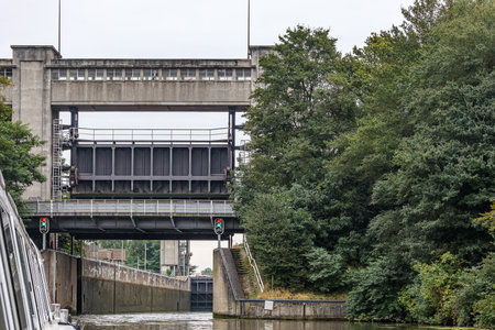 Navigation canal at Bosscherveld lock, bridges at entrance and exit gates, red and green traffic...