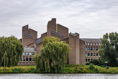 Government building known as Gouvernement aan de Maas, modern irregularly shaped building on river...