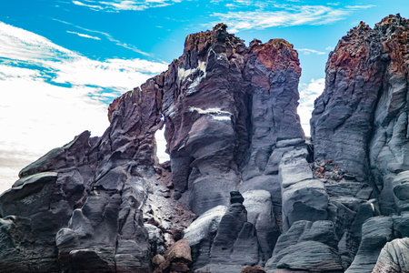 Rock formations on Mexican coast of Coronado Island, hardened volcanic lava and stone with rough...