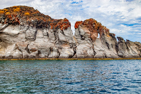 Mexican coastal landscape with volcanic lava rock formations, Coronado Island, cloudy day in Loreto Bay National Marine Park in Baja California Sur, Mexicoの写真素材