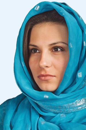 Portrait of a girl in a blue scarfの写真素材