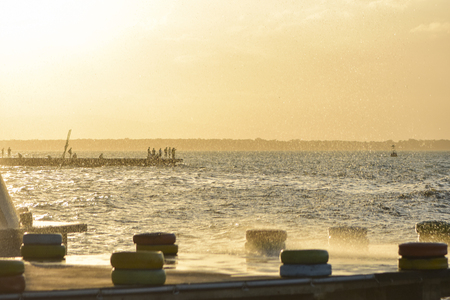 dramatic rain storming sunset on the seaの写真素材