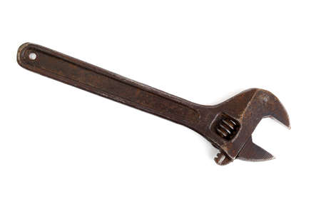 Old adjustable wrench isolated on whiteの写真素材