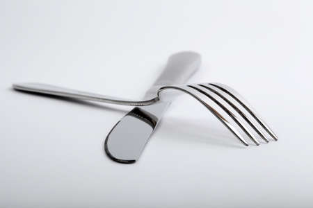 Silver fork and knife on the table