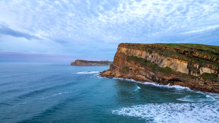 Stunning view of coastal cliffs in Suances, Spain, showcasing the rugged beauty of the cliffs,...
