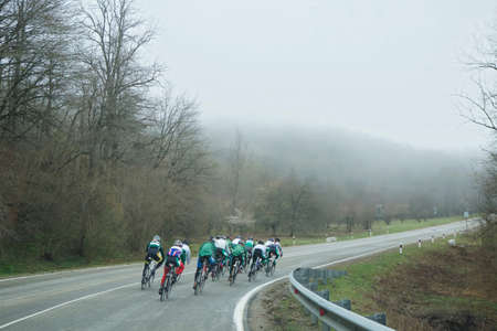 On the road cyclists go, there is a training or competition.の写真素材