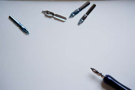Elegant vintage feather pen on blank paper