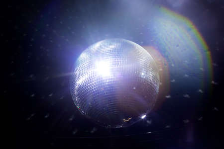 Mirror ball club against the black ceiling.の写真素材