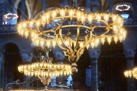 ISTANBUL, TURKEY - November 22, 2021: The famous AyaSophia Mosque. Chandeliers and lighting in the temple. The history of Byzantium and the Ottoman Empire.のeditorial素材